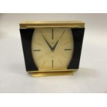 A late 1960s/early 70s mantel clock by Gruen of Geneve in gilt metal and black lacquered case with