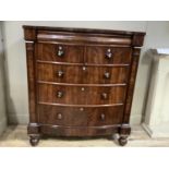 A mid Victorian mahogany chest of drawers, semi bow front having a frieze drawer above two short and