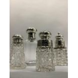 Four Edwardian cut glass silver mounted scent bottles, Birmingham 1900, 1902 and 1906 and Chester