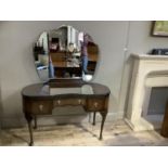 A walnut veneered dressing table with triple mirrors