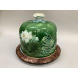 A 19th century majolica cheese dish and cover, possibly by Mintons, moulded with lily pads with