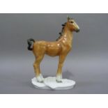 A Volkstedt porcelain figure of a foal on white moulded base, 20cm high, printed mark in green