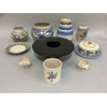 A collection of Poole pottery including Carter Stabler Adams mark, bluebird vase, banded vase,