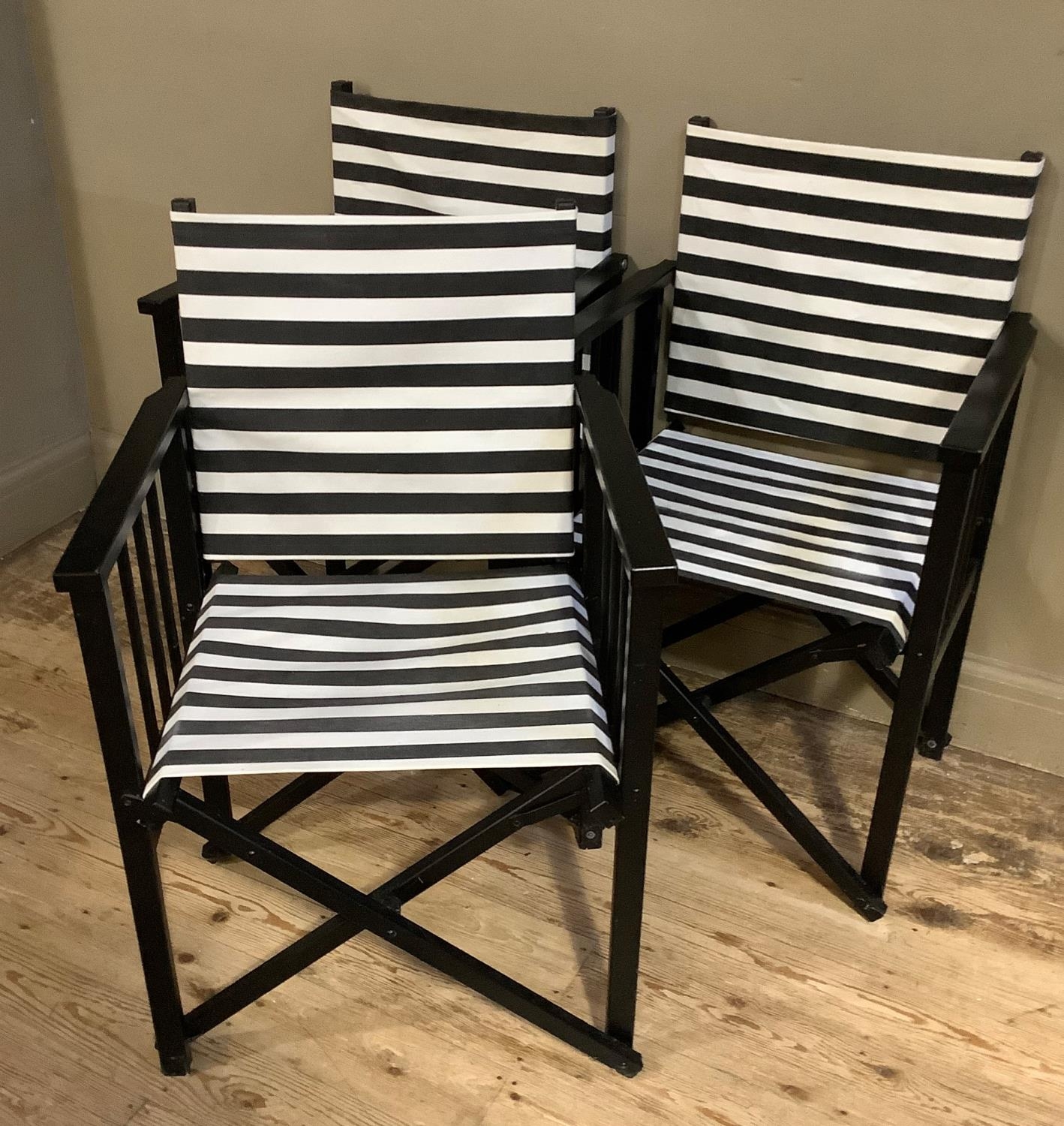 A set of three black framed director's chairs with black and white striped fabric seating - Bild 3 aus 3