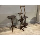 An Edwardian folding four tier cake stand together with a reproduction wine table