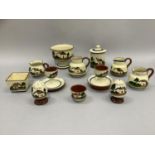 A collection of Torquay ware, earthenware with white slip painted in green, brown and blue and