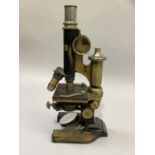 A microscope by Shards of Forest Hill, SE23 in a fitted case circa 1900 with additional lenses and