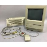 An Apple Macintosh Classic 2 desk top computer and keyboard and mouse c.1991, in clean tidy order