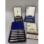 Four cases of plated cutlery viz:- six silver handled tea forks, Sheffield 1958, six tea knives,