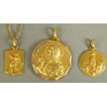 Three Christian religious medals and a fine trace link chain all in yellow metal (tests as 18ct