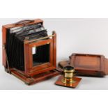 A THORNTON PICKARD MAHOGANY AND BRASS MOUNTED FOLDING CAMERA, 25.5cm square together with two