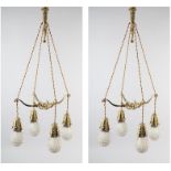 A PAIR OF EARLY 20TH CENTURY FRENCH GILDED BRASS PENDANT LIGHT FITTINGS, each cast as two crossed