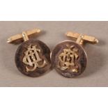 A PAIR OF CUFFLINKS IN 9CT GOLD c.1968 each circular face with applied monogram, secured by an