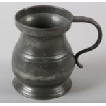 A VICTORIAN HALF PINT PEWTER TANKARD, stamped and maker's stamp '9' to the rim, 9cm high