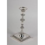 A GEORGE III SILVER TAPERSTICK BY JOHN CARTER, London 1772, baluster stem with spool-shaped sconce