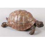 AN AUSTRIAN COLD PAINTED TORTOISE INKWELL, hinged shell lacking liner, stamped to underside