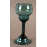 A PEACOCK BLUE WINE GLASS, c.1755 the double ogee bowl on a straight stem with basal flattened knop,