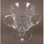 A TWIN HANDLED LOVING CUP OR CHRISTENING MUG, the bucket body engraved with strands of foliage and