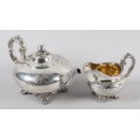 A VICTORIAN SILVER TEAPOT AND CREAM JUG B Savory & Sons, London 1859, of compressed circular form,