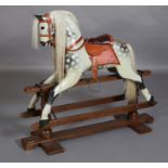 A ROCKING HORSE BY STEVENSON BROS 1997, dapple grey with horse hair mane and tail, leather saddle