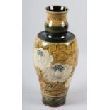 A DOULTON LAMBETH STONEWARE VASE BY FRANCIS C POPE, the tapered body incised with magnolia blossom