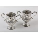 A PAIR OF 18TH CENTURY IRISH SILVER TWO-HANDLED CUPS, Matthew West, Dublin 1775, embossed with a