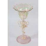 AN 18TH CENTURY VENETIAN 'SERPENT STEM' GLASS GOBLET, of pink and green line with gilt inclusions,