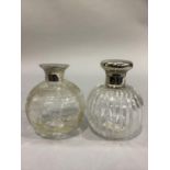 TWO GLOBULAR CUT GLASS SCENT BOTTLES, one with reeded strapwork, silver collar and plain hinged top,