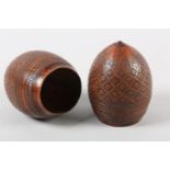 A PAIR OF 18TH CENTURY CARVED AND POLISHED COCONUT SHELL CUPS, worked with a flower head filled