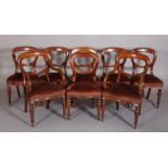 A SET OF EIGHT VICTORIAN MAHOGANY BALLOON BACK DINING CHAIRS, upholstered seats on lobed and