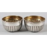 A PAIR OF VICTORIAN SILVER SALTS, Mappin & Webb, Sheffield 1892, of circular reeded open form, 5.5cm