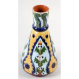 A CARLO MANZONI EARTHENWARE VASE OF CARAFE FORM WITH KNOPPED NECK, incised and painted with leaf-