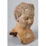 A TERRACOTTA BUST OF A LADY, one of a set of devotional images from a Neopolitan Nativity scene, c.