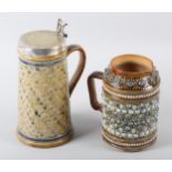 A DOULTON LAMBETH STONEWARE JUG, applied bosses to the neck on a star impressed ground above all-