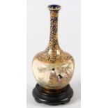 A JAPANESE POTTERY VASE, MEIJI PERIOD, slender neck and rounded body painted and gilt with panels of