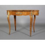 A FRENCH WALNUT AND GILT MOUNTED TABLE of serpentine quatrefoil outline