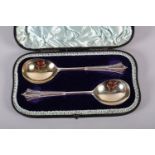 A PAIR OF VICTORIAN SILVER SERVING SPOONS, Robert Stebbings, London 1892, with silver gilt bowls, in