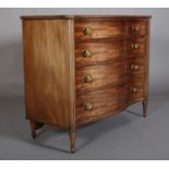 A GEORGE III MAHOGANY SERPENTINE FRONTED CHEST, of four graduated drawers, cockbeaded with gilt