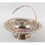 A GEORGE IV SCOTTISH SILVER FRUIT BASKET, Mitchell & Sons, Glasgow 1825, circular, the rim cast