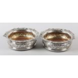 A PAIR OF EARLY 19TH CENTURY SILVER COASTERS, Thomas Robins, London 1818, foliate and C-scroll rim