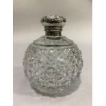 A GLOBULAR HOB NAIL CUT GLASS SCENT BOTTLE with silver collar and repoussé hinged top, Birmingham