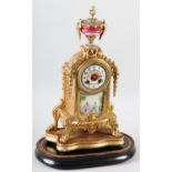 A 19TH CENTURY FRENCH GILT METAL AND PORCELAIN MANTEL CLOCK having a circular dial with black Arabic