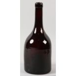 A 19TH CENTURY BROWN BOTTLE OF MALLET FORM AND LONG NECK, string rim, the body with horizontal