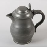 A PEWTER JUG, baluster form with double dome lid, thumb piece, marked with 'X' LONDON and crown to