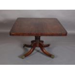 A GEORGE IV MAHOGANY BREAKFAST TABLE having a rectangular tilt top on a vase turned pedestal and