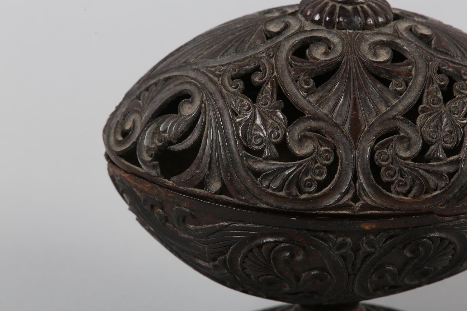 AN 18TH CENTURY CARVED COCONUT SHELL PEDESTAL DISH AND COVER, finely pierced and worked with - Image 3 of 5