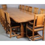 SHAW & RILEY OF HESSAY 'THE SEAHORSEMEN', an oak dining suite comprising a large refectory table