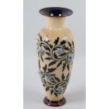 A DOULTON LAMBETH STONEWARE VASE by George Tinworth, the tapered body incised with foliage, beadwork