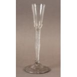 A CORDIAL WINE GLASS c.1780, the elongated bell shaped bowl set on a very long stem with an