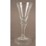 A SMALL PEDESTAL WINE GLASS with funnel bowl set on a four sided Silesian tapered stem and on